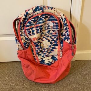 Pink north face back pack
